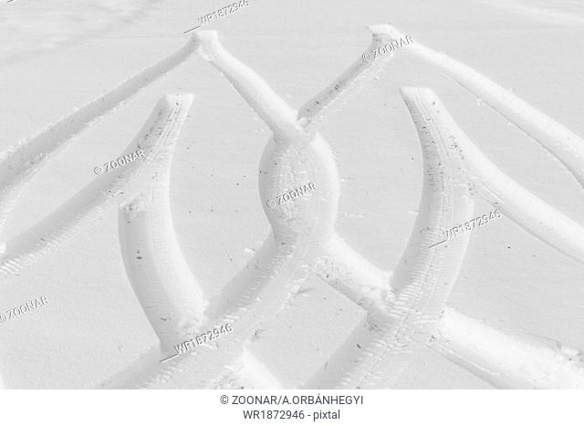 Traces from wheels of the car on snow
