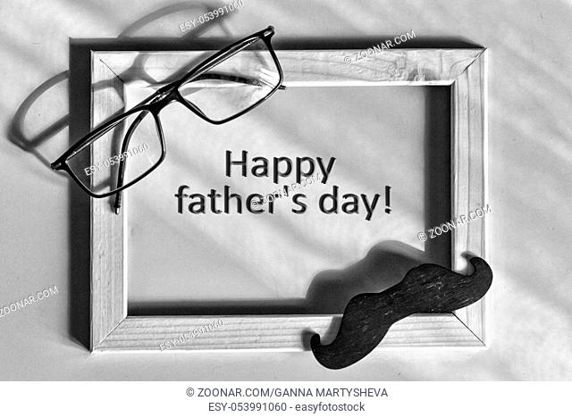 Black and white. Fathers day. Homemade gift box, the symbols of Father's Day-glasses, mustaches, Best father. Child and father concept