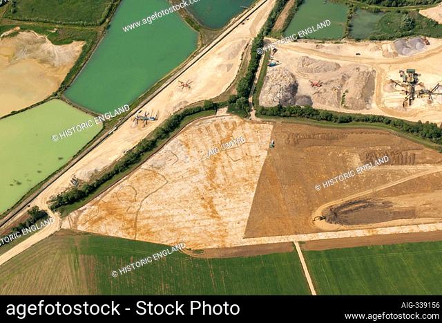 Soilmarks of a possible Prehistoric or Roman farmstead revealed by mineral extraction, near Witney, Oxfordshire, 2015. Aerial view