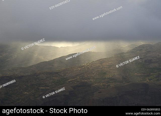 Lights illuminating the landscape on a stormy day. The Nublo Rural Park. Gran Canaria. Canary Islands. Spain