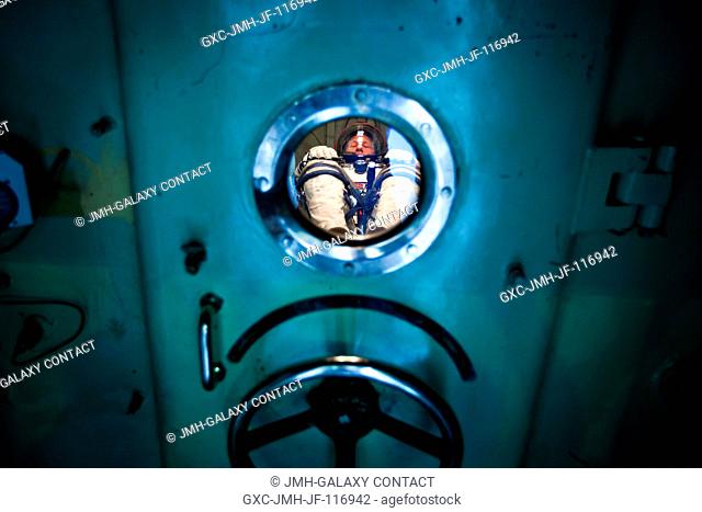 NASA astronaut Doug Hurley, STS-135 pilot, waits in a pressure chamber before a test of his Sokol spacesuit at the Zvezda facility in Moscow March 30, 2011