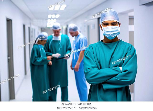 Portrait of surgeon standing in corridor