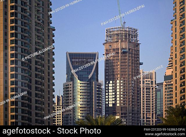 02 December 2023, United Arab Emirates, Dubai: Residential and commercial buildings parallel to Sheikh Zayed Road southwest of the city center