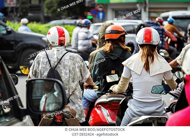 Street setting, moped riders on a street at Saigon, Hoh Chi Minh City, Vietnam, Asia