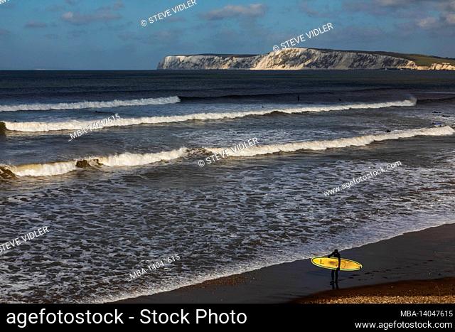 england, isle of wight, coastal view surfers at brightstone bay