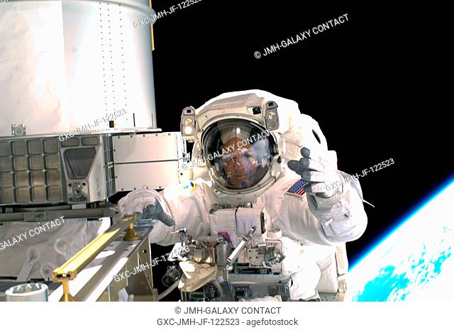 Astronaut Richard Arnold, STS-119 mission specialist, participates in the mission's first scheduled session of extravehicular activity (EVA) as construction and...