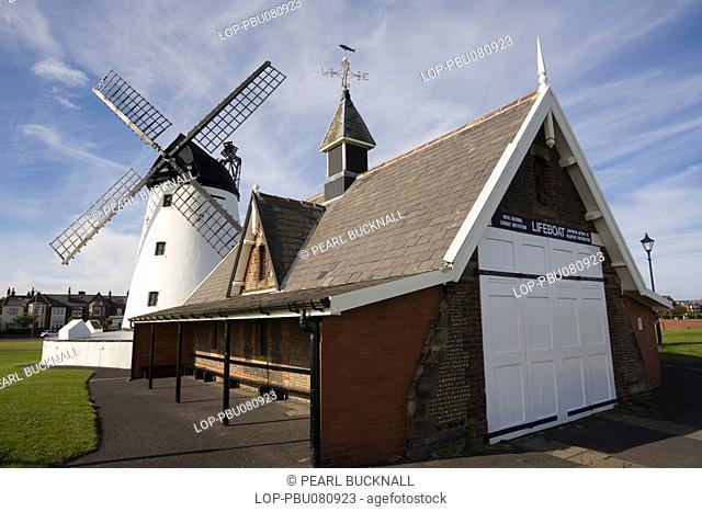 England, Lancashire, Lytham, The old lifeboat station building and restored windmill on the seafront beside the Fylde estuary
