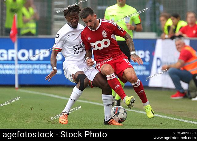 OHL's Hamza Mendyl and Standard's Aron Donnum fight for the ball during a soccer match between Standard de Liege and Oud-Heverlee Leuven