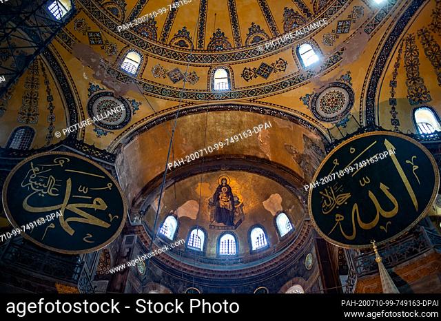 10 July 2020, Turkey, Istanbul: A mosaic depicting the Christian Mother of God with the Child Jesus can be seen between Islamic characters in the Hagia Sophia