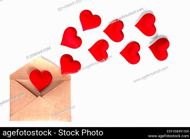 Valentine day love letter, envelope of craft paper with red hearts heap spread isolated on white background