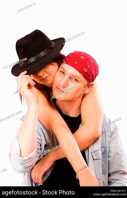 Couple holding together wearing hat and headscarf isolated