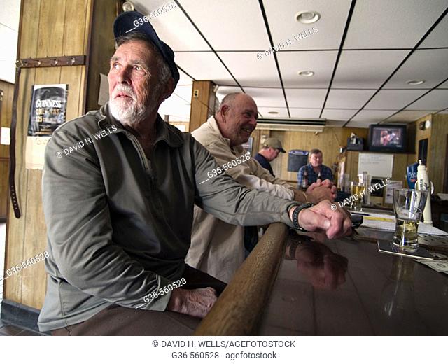 Ron Turgeon, Quahogger, gets a drink at a bar in East Greenwich, Rhode Island after day of shellfishing