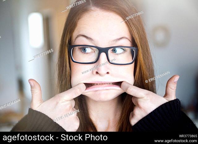 Young woman with eyeglasses, portrait