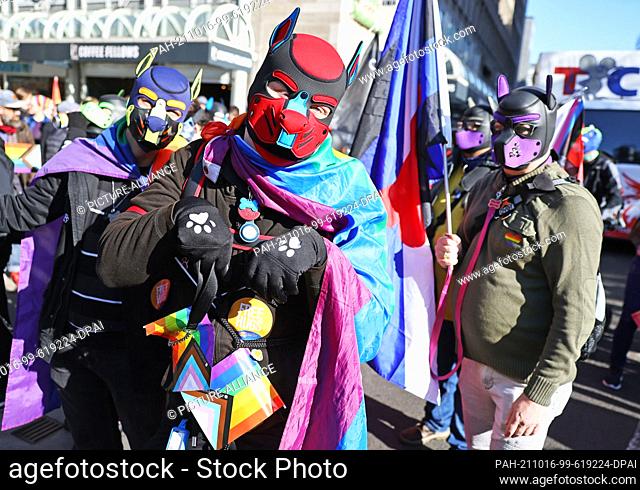 16 October 2021, North Rhine-Westphalia, Duesseldorf: Participants of the Christopher Street Day rally march through the city centre