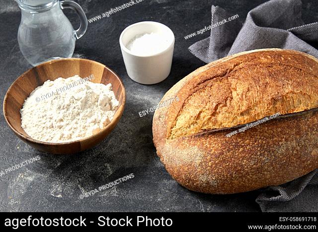 bread, wheat flour, salt and water in glass jug