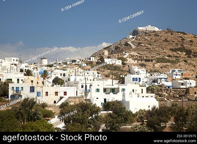 Whitewashed houses at the old town Chora or Chorio with the Zoodohos Pigi Monastery on the top of the hill at the upper side of the Kastro or Castle village