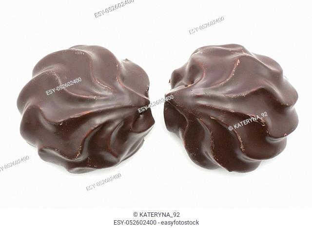 Two dark chocolate-coated zefir top view isolated on white background
