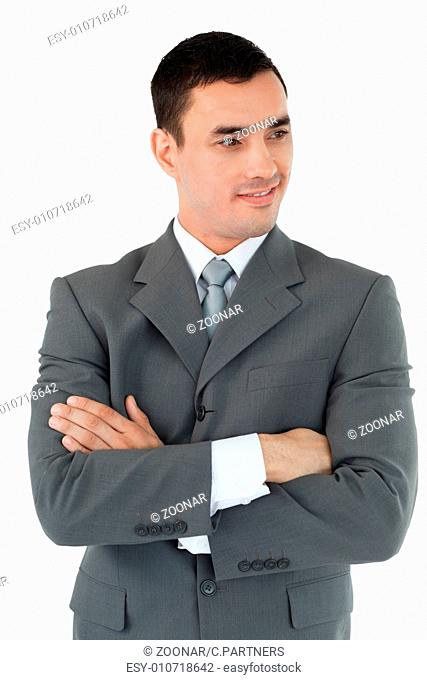 Businessman with arms folded looking to the side
