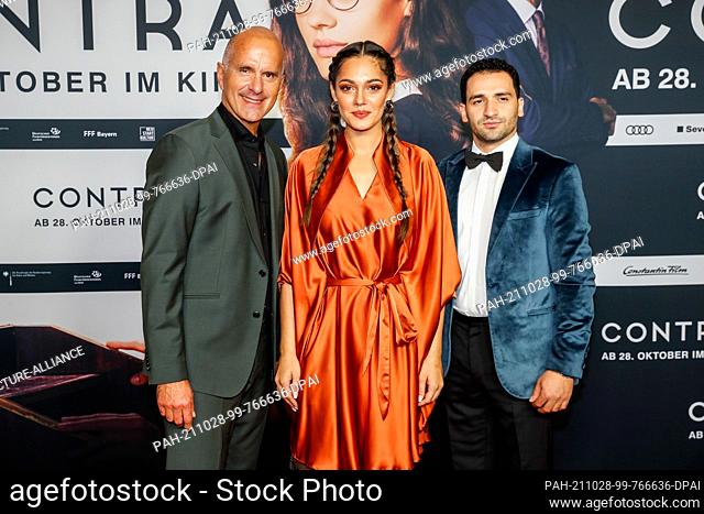 27 October 2021, Berlin: Christoph Maria Herbst (l-r), Nilam Farooq and Hassan Akkouch arrive at the premiere of the film ""Contra"" at the Zoo Palast cinema