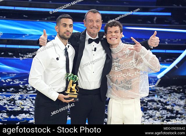 The winners Mahmood and Blanco with television host Amadeus at the 72 Sanremo Festival. Final evening. Gai Mattiolo, Valentino and Burberry clothes