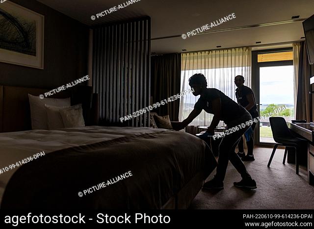 08 June 2022, Baden-Wuerttemberg, Donaueschingen: Two employees of the ""Öschberghof"" clean a hotel room. At the German Hotel Congress taking place on June 14...