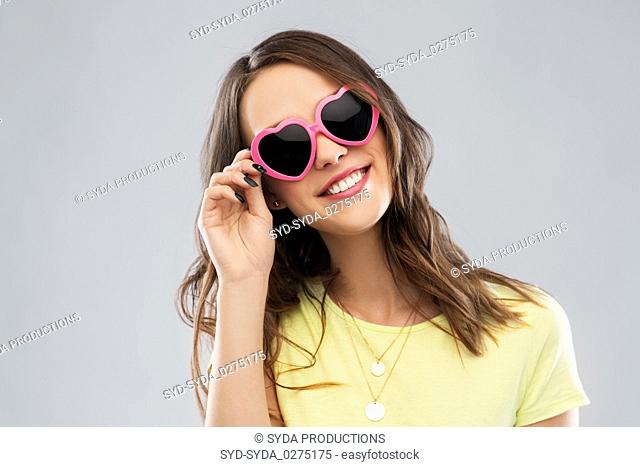 teenage girl in heart-shaped sunglasses