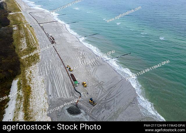 14 September 2017, Mecklenburg-Western Pomerania, Ahrenshoop: New sand is flushed via a pipeline from a special ship onto an approximately four-kilometer-long...