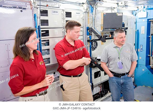 NASA astronaut Doug Wheelock (center), Expedition 24 flight engineer and Expedition 25 commander; along with NASA astronaut Shannon Walker and Russian cosmonaut...