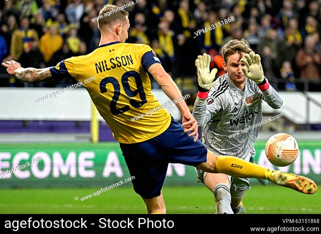 Union's Gustaf Nilsson and Berlin's goalkeeper Frederik Ronnow fight for the ball during a soccer game between Belgian Royale Union Saint-Gilloise and German...