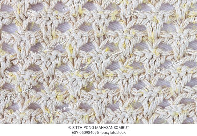 Yellow Knitting Pattern or Knitted Pattern Background in macro style. Knitting Pattern or Knitted Pattern in vintage style for design
