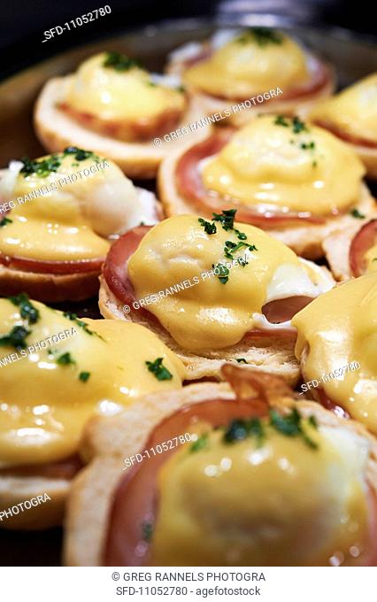 English Muffins Topped with Canadian Bacon, Eggs and Hollandaise Sauce