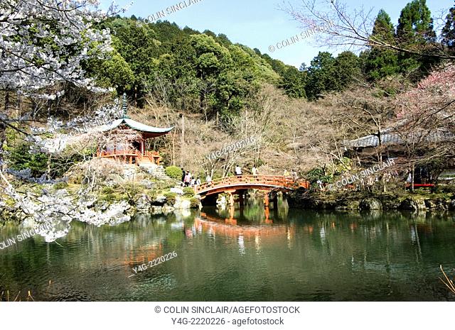 Daigoji Temple, Nr Kyoto, Japan, Bentendo Hall seen over pond, Early Spring sunshine, Red bridge, Cherry Blossom, Tourists, Horizontal