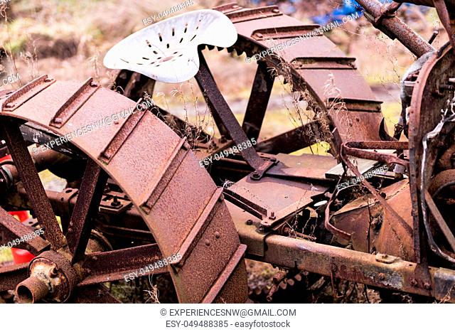 Rusty steel tractor wheels and seat cropped