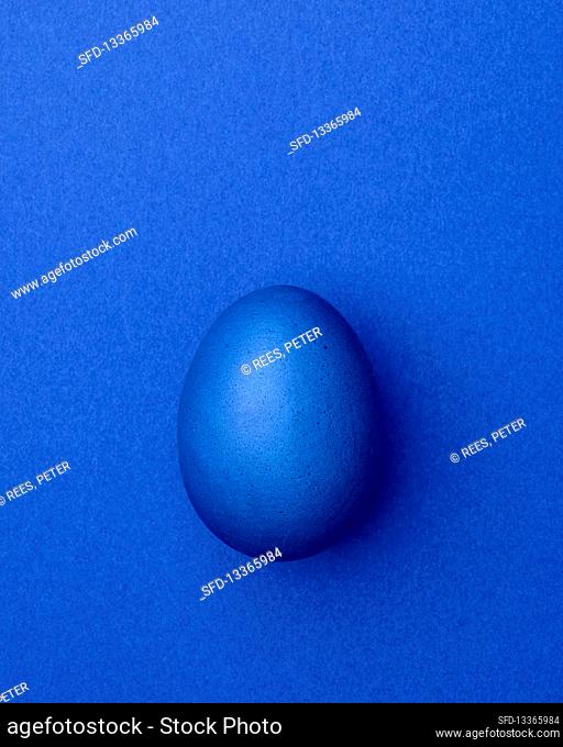 Blue Easter egg on a blue background