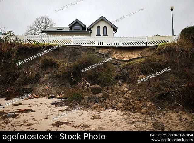 PRODUCTION - 18 December 2023, Schleswig-Holstein, Schilksee: Damage after the Baltic Sea flood can be seen on the coast in Schilksee near Kiel