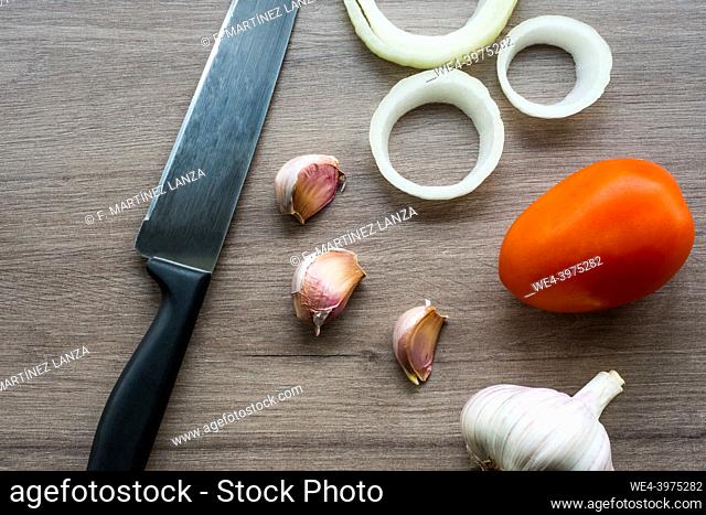 Vegetables with a knife on a table