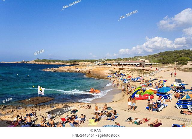 Tourists on beach, Cala Comte, Ibiza, Balearic Islands, Spain