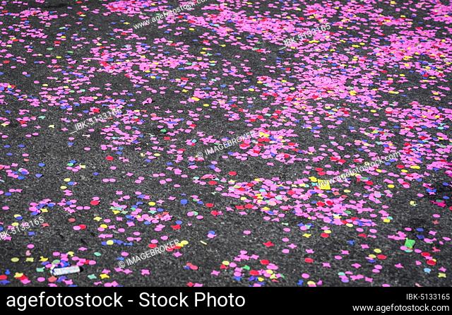 Colourful confetti after a carnival procession in the street, Rosenmontag, Güdismäntig, Lucerne carnival, Lucerne, Switzerland, Europe