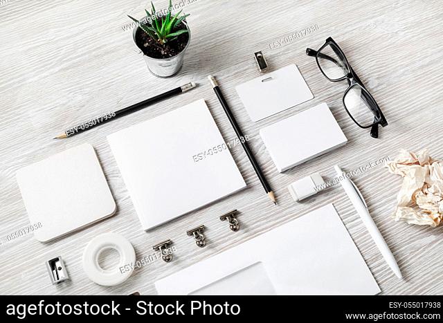 Stationery mock up. Blank corporate identity template on light wood table background. Responsive design mockup