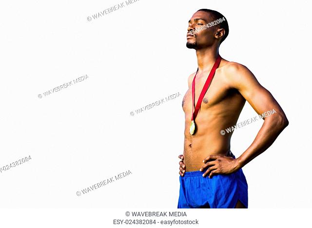 Athletic man posing with his gold medal