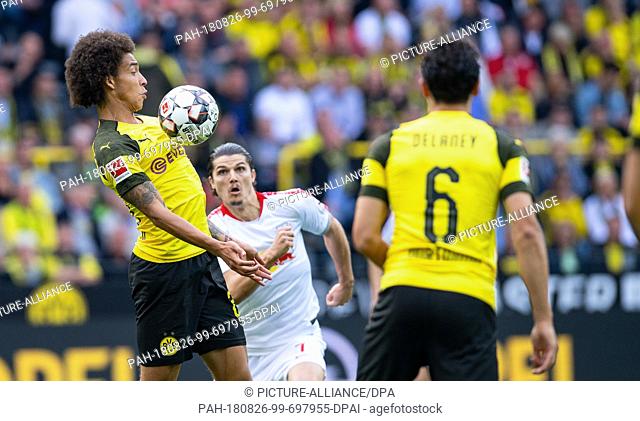 26 August 2018, Germany, Dortmund, Soccer, Bundesliga, Borussia Dortmund vs RB Leipzig, 1st matchday in Signal Iduna Park: Dortmund's Axel Witsel (l) takes the...