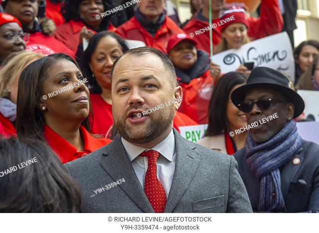 NYC Council Speaker Corey Johnson joins activists, community leaders, union members and other politicians on the steps of City Hall in New York on Tuesday