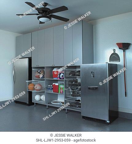 STORAGE: stainless steel refrigerator and beer kegger, wire pull out baskets with balls, shoes, sporting equipment, coolers, peg board, broom