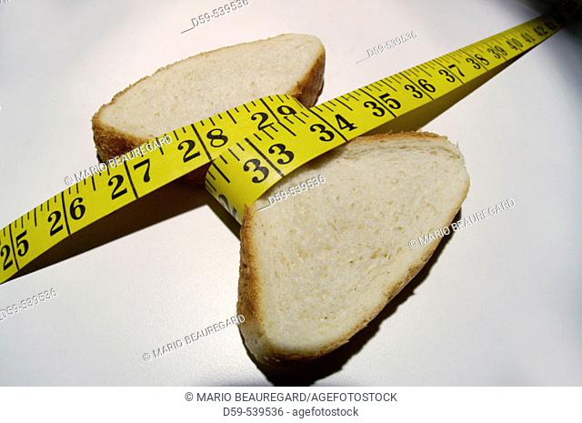 Piece of bread measuring waistline