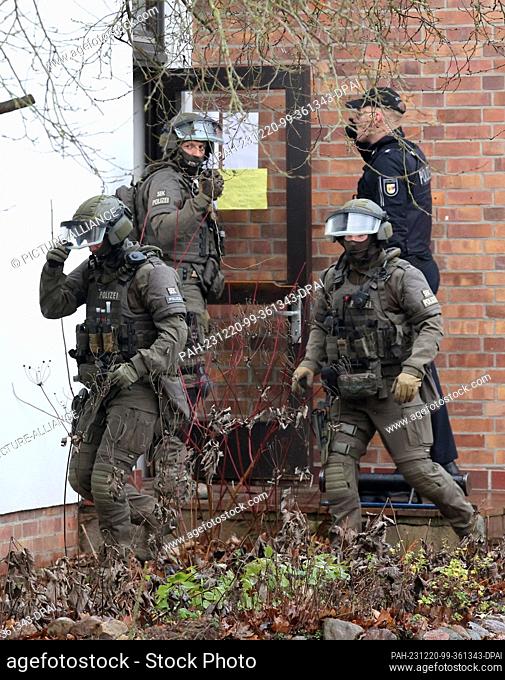 20 December 2023, Mecklenburg-Western Pomerania, Schwerin: A special police unit is deployed during a planned deportation from a church building