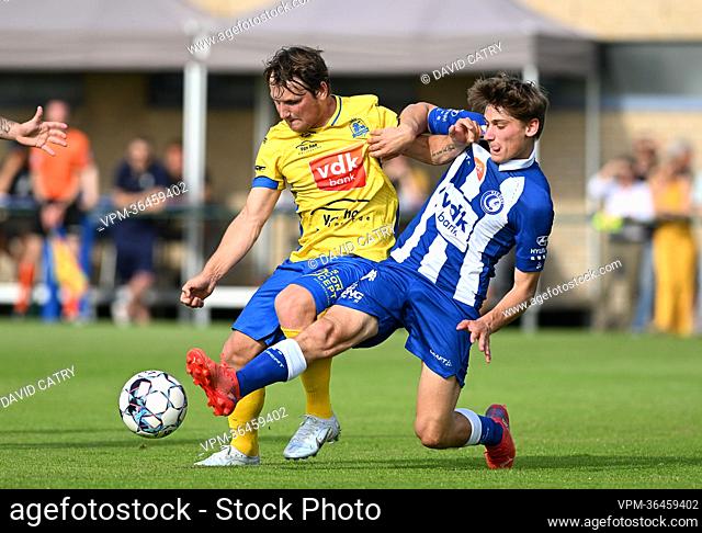 Gent's Robbie Van Hauter fight for the ball during a friendly game between KSC Dikkelvenne and first division soccer team KAA Gent