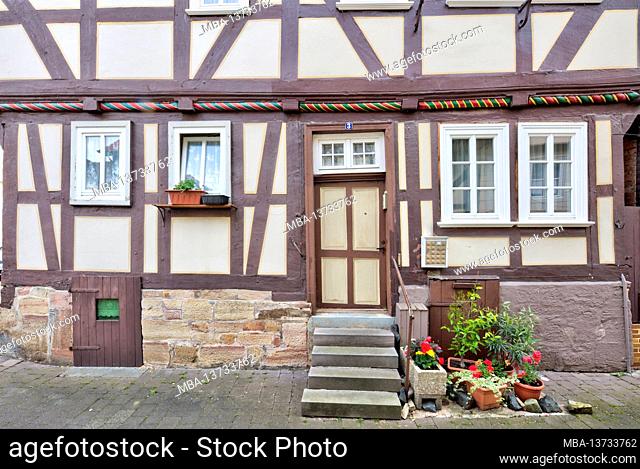 Front door, windows, half-timbered houses, house facade, floral decorations, summer, Rotenburg an der Fulda, Hesssen, Germany, Europe