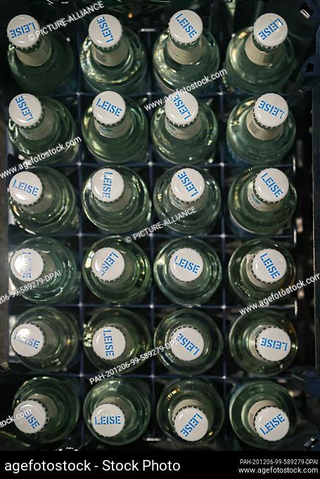 05 December 2020, Hamburg: Mineral water bottles of the brand ""Viva con Agua"" are in a beverage crate. The mineral water is a licensed product of Viva con...