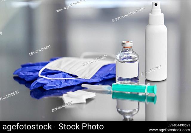 syringe, medicine, wound wipes, gloves and mask