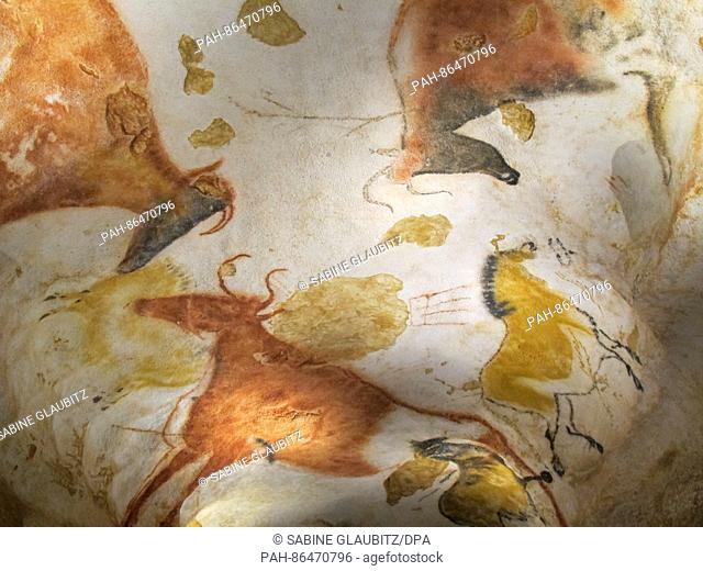A reproduction of the prehistoric cave painting of horses, aurochses, and a red buffalo at the Centre International de l'Art parietal Montignac-Lascaux in...